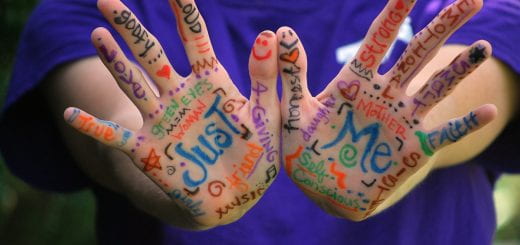 hands of a person with "Just me" written on them