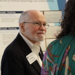 Image shows a man at the poster session.
